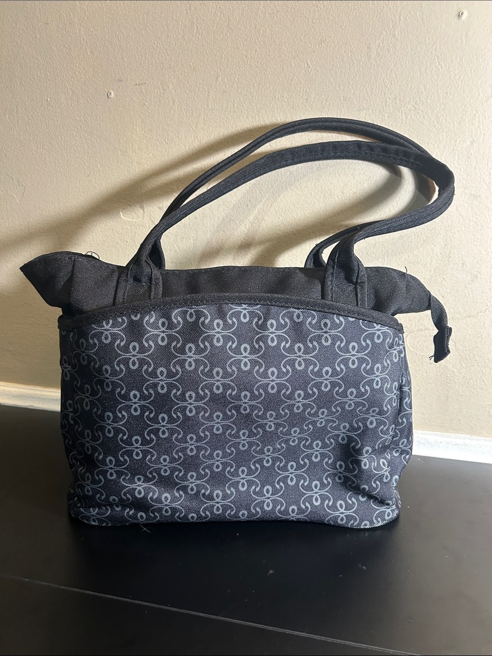 The First Years black and grey patterned canvas diaper bag tote